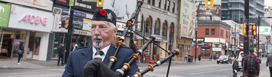 Toronto’s Yonge St. lined with  pipers on Remembrance Day